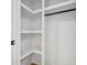 Organized closet featuring built-in shelving and a hanging rod, perfect for storage at 4327 Wellington Hills Ln, Snellville, GA 30039