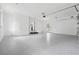 Large garage featuring a sealed floor, storage, and backyard access at 4327 Wellington Hills Ln, Snellville, GA 30039