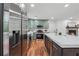 Spacious kitchen features stainless appliances and an island with seating at 4327 Wellington Hills Ln, Snellville, GA 30039