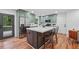 Spacious kitchen features stainless appliances, large island, and door to the back deck at 4327 Wellington Hills Ln, Snellville, GA 30039