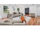 Comfortable living room with fireplace, hardwood floors, and open layout at 4327 Wellington Hills Ln, Snellville, GA 30039