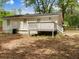 Backyard view features deck, home's rear exterior, and storage building at 5438 Hiram Lithia Springs Rd, Powder Springs, GA 30127