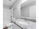 Bathroom with granite vanity top, toilet and tub with shower at 5438 Hiram Lithia Springs Rd, Powder Springs, GA 30127