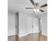 Bedroom featuring wood floors, two closets, and neutral paint at 5438 Hiram Lithia Springs Rd, Powder Springs, GA 30127