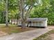 Lovely home with a cozy front porch and a long driveway, set amidst lush greenery at 5438 Hiram Lithia Springs Rd, Powder Springs, GA 30127