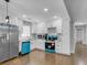 Updated kitchen with white cabinetry, granite countertops, and stainless steel appliances at 5438 Hiram Lithia Springs Rd, Powder Springs, GA 30127