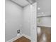 Laundry hook-ups leading to spacious room with baseboards and wood floors at 5438 Hiram Lithia Springs Rd, Powder Springs, GA 30127