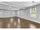 Spacious living room with hardwood floors, recessed lighting, and bright windows at 5438 Hiram Lithia Springs Rd, Powder Springs, GA 30127