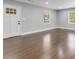 Bright living space with beautiful hardwood floors, large windows, and a welcoming entrance at 5438 Hiram Lithia Springs Rd, Powder Springs, GA 30127