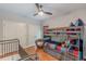 A charming bedroom featuring sports-themed bedding, a bunk bed, and gleaming hardwood floors at 9465 Grande Dr, Winston, GA 30187