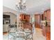 Charming breakfast nook features a glass table with access to the kitchen at 9465 Grande Dr, Winston, GA 30187