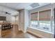 Bright dining area with large windows, woven shades, and view to a green yard at 9465 Grande Dr, Winston, GA 30187