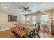 Dining room boasting natural light, a rustic wood table, and minimalist decor, creating a warm and inviting space at 9465 Grande Dr, Winston, GA 30187
