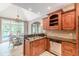 Kitchen with granite countertops, stainless steel dishwasher, and custom cabinets at 9465 Grande Dr, Winston, GA 30187