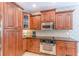 Kitchen featuring stainless steel appliances, custom cabinets and granite countertops at 9465 Grande Dr, Winston, GA 30187