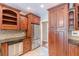 Spacious kitchen with stainless appliances and custom wood cabinetry at 9465 Grande Dr, Winston, GA 30187