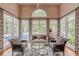 Bright living room featuring a large window with a view of the pool, a sofa, and hardwood flooring at 9465 Grande Dr, Winston, GA 30187