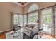 Living room filled with natural light, a view of the pool, and comfortable seating at 9465 Grande Dr, Winston, GA 30187