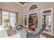 Open concept living room featuring hardwood flooring, a fireplace, and lots of natural light at 9465 Grande Dr, Winston, GA 30187