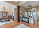 Elegant living space offering a decorative column, hardwood floors, and sophisticated dining area at 9465 Grande Dr, Winston, GA 30187
