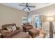 Comfortable living area featuring plush seating, hardwood floors, and a view into the adjacent office at 9465 Grande Dr, Winston, GA 30187