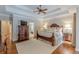 Large main bedroom boasts hardwood floors, a decorative ceiling, and a walk-in closet at 9465 Grande Dr, Winston, GA 30187