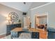 Inviting home office boasting hardwood floors, stylish decor, and a black executive desk at 9465 Grande Dr, Winston, GA 30187
