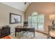 Home office featuring vaulted ceiling, large windows, and a wooden desk with an executive chair at 9465 Grande Dr, Winston, GA 30187
