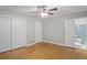 Bright, spacious bedroom featuring hardwood floors, a ceiling fan, and closet space at 2732 Elkhorn Dr, Decatur, GA 30034