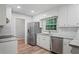 Modern kitchen with stainless steel appliances, granite countertops, and updated fixtures, offering style and functionality at 2732 Elkhorn Dr, Decatur, GA 30034