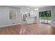 Open-concept space with hardwood floors flowing into the kitchen and sliding glass doors to the backyard at 2732 Elkhorn Dr, Decatur, GA 30034