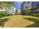 Lush backyard with green grass, landscaping, and benches for outdoor enjoyment at 834 S Columbia Dr, Decatur, GA 30030
