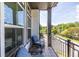 A cozy balcony features seating and a view of the surrounding neighborhood at 834 S Columbia Dr, Decatur, GA 30030