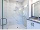 Bathroom with a glass enclosed shower featuring large-format marble-look tiles at 834 S Columbia Dr, Decatur, GA 30030