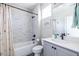 Modern bathroom with a tub-shower combination, stylish vanity, and contemporary fixtures enhancing its appeal at 834 S Columbia Dr, Decatur, GA 30030