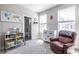 Charming Bedroom with a view of the en-suite bathroom featuring a comfortable armchair and ample storage at 834 S Columbia Dr, Decatur, GA 30030