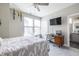 Inviting bedroom with a comfortable bed, ceiling fan, and a view of the en-suite bathroom offering convenience at 834 S Columbia Dr, Decatur, GA 30030