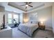 Bright and airy bedroom with a king-sized bed and a tray ceiling at 834 S Columbia Dr, Decatur, GA 30030