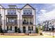 Well-maintained townhome with a balcony and manicured landscaping at 834 S Columbia Dr, Decatur, GA 30030