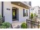 Welcoming front entrance with a brick pathway, black railing, and a stylish black door with a wreath at 834 S Columbia Dr, Decatur, GA 30030