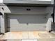 Garage door with black hardware, set against a painted brick exterior at 834 S Columbia Dr, Decatur, GA 30030