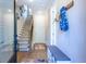 Welcoming hallway with hardwood floors, a coat rack, and staircase leading to the upper levels at 834 S Columbia Dr, Decatur, GA 30030