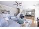 Spacious living room and eat-in kitchen with a large sectional sofa and stairs in the background at 834 S Columbia Dr, Decatur, GA 30030