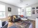 Comfortable living room featuring a gray sofa, colorful rug and lots of natural light at 834 S Columbia Dr, Decatur, GA 30030