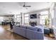 Open-concept living room with hardwood floors, grey sofa and plenty of natural light at 834 S Columbia Dr, Decatur, GA 30030