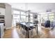 Sun-filled living room with large windows, hardwood floors, comfortable seating, and stylish decor at 834 S Columbia Dr, Decatur, GA 30030