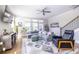 Comfortable living room with stylish decor, modern furniture, large windows, and an open staircase at 834 S Columbia Dr, Decatur, GA 30030