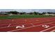 Red running track with numbered lanes and field in the background at 834 S Columbia Dr, Decatur, GA 30030