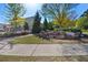 Inviting community entrance showcasing lush landscaping, mature trees, and a charming bench area at 111 Centennial Ridge Dr, Acworth, GA 30102