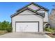 Two story home with attached two car garage and well manicured lawn at 111 Centennial Ridge Dr, Acworth, GA 30102